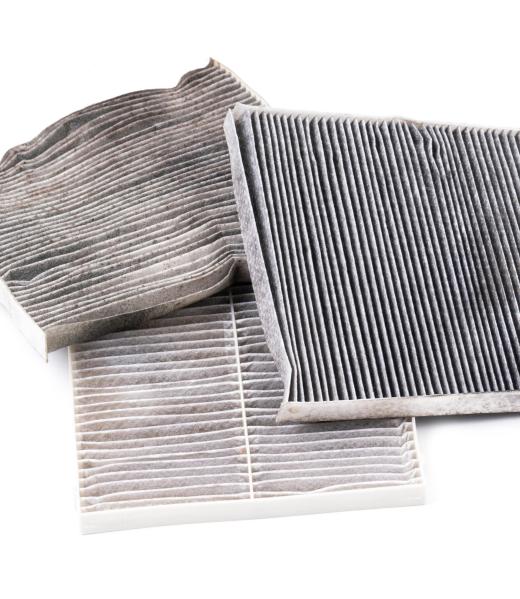 dirty car air conditioning filter isolated on white background